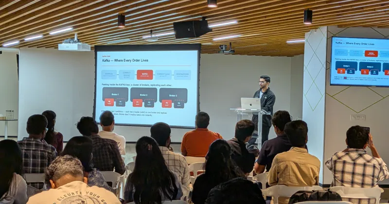 Ashfaq presenting a slide of Kafka brokers replicating partitions to an audience at Apache Kafka Meetup Hyderabad